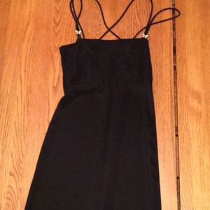 Mid-length black dress.